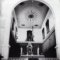 Photo of the sanctuary of the Parish Church of the Assumption of the Blessed Virgin Mary in Vis, taken in 1976. On the sanctuary wall, above the main altar, stands the painting of the Sacra Conversazione by Girolamo da Santa Croce, framed by the modified remains of wooden architecture of the former polyptych (photo archive of the Conservation Department in Split)
