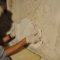Conservation work on the relief with the Bishop’s throne motif, replacing the stone fillers (photo by Ivka Lipanović, 2013, Croatian Conservation Institute Photo Archive)